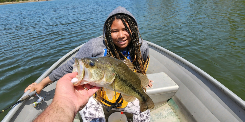 LMS student poses with a fish