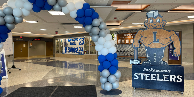 Lackawanna Middle School entrance decorated with balloons and posters for first week of school