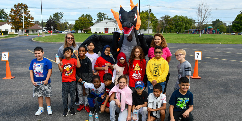 MR Students stand with Dragon at walk-a-thon